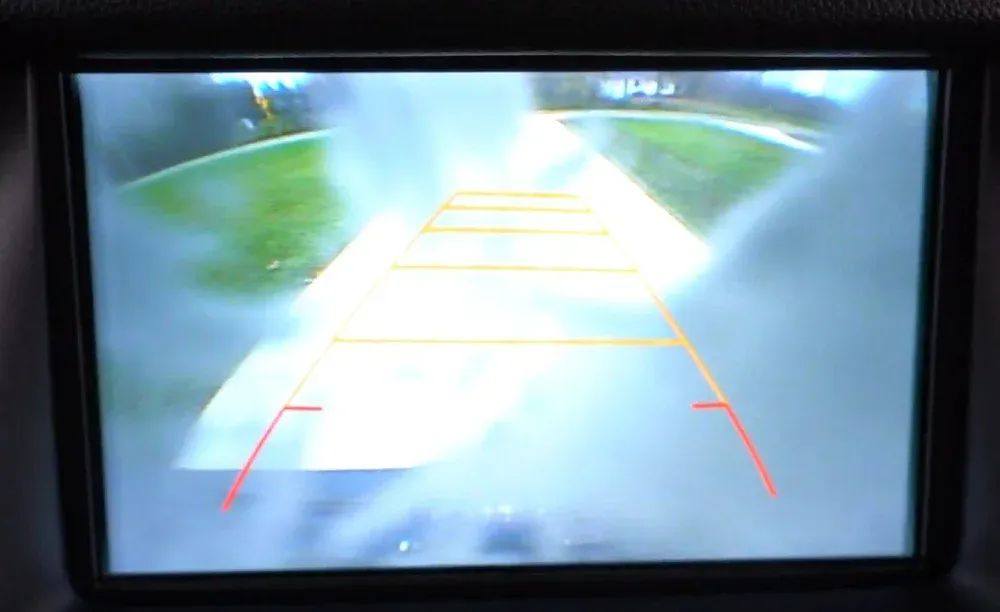 In-dash screen showing backup camera guidelines