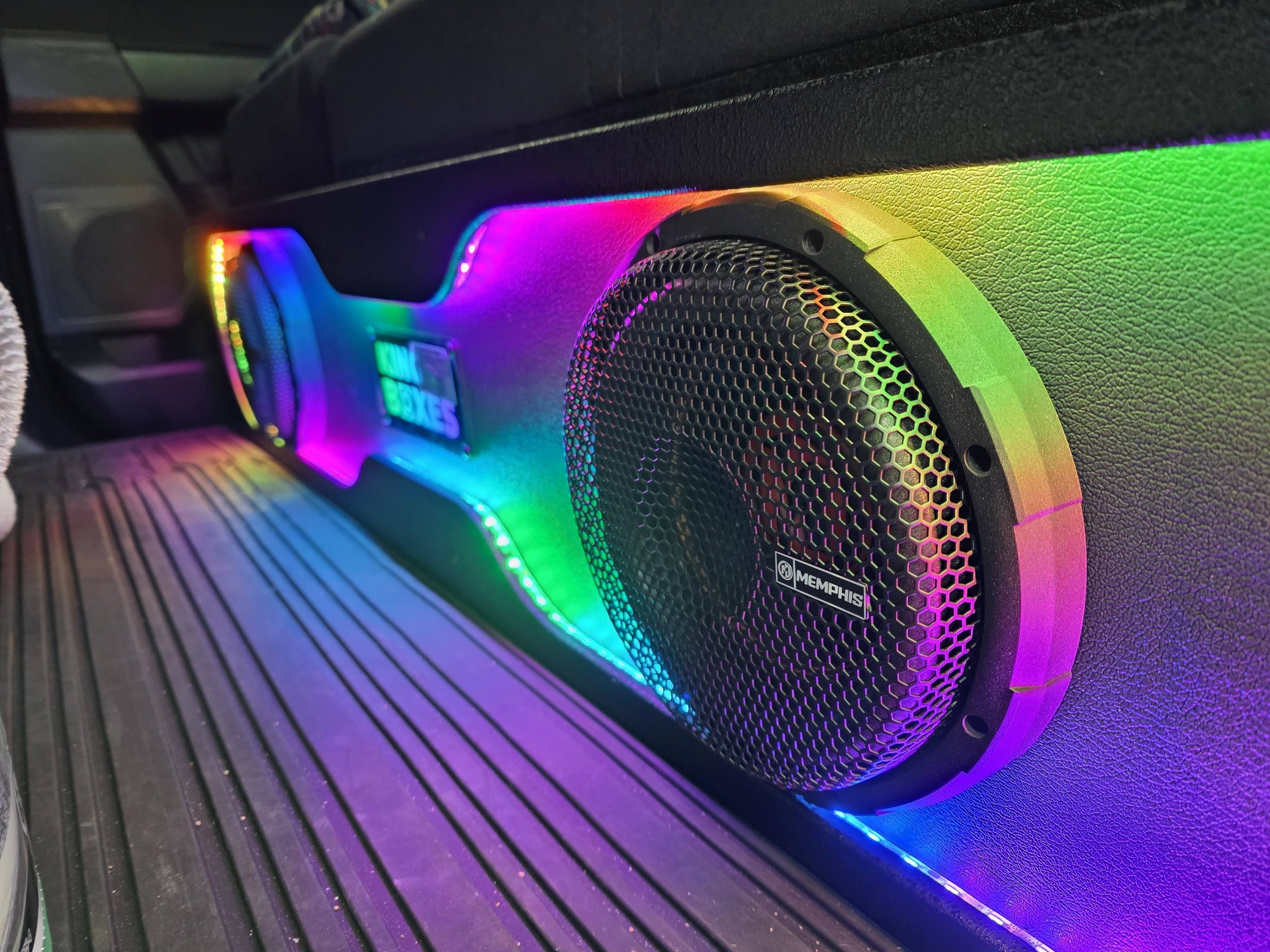 Custom speaker installation lit with colourful accent lighting
